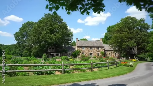 Stone house exterior with garden and sky