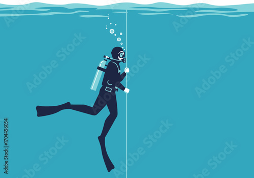 Scuba diver exploring the depths of the ocean, holding onto a line for guidance and safety