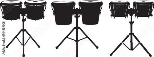 Three sets of conga drums on stands in a striking black silhouette