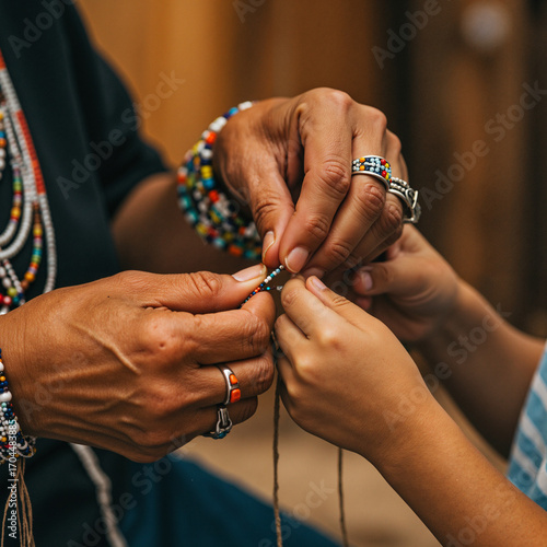 Native American. A child learning about traditional beadwork from an elder's hands, generational connection, teaching, close-up, emotional, warm and inviting light.