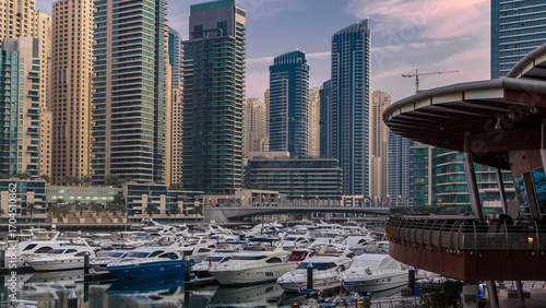 Dubai Marina at Blue hour night to day timelapse with yachts
