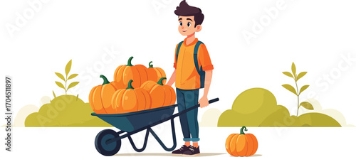 Young man with a wheelbarrow full of freshly harvested pumpkins.