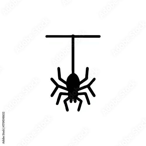 Black spider hangs ominously from string for Halloween

