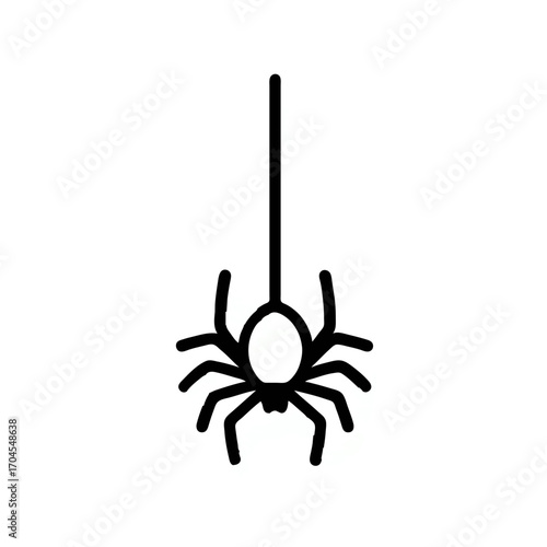 Black spider hangs ominously from string for Halloween

