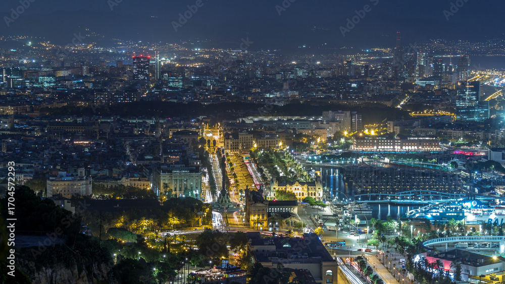 Obraz premium Aerial view over square Portal de la pau day to night timelapse in Barcelona, Catalonia, Spain.