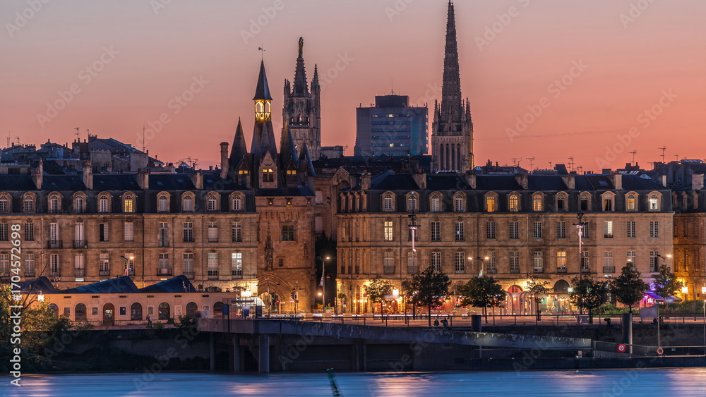 Fototapeta premium Panoramic view of Bordeaux city skyline day to night transition timelapse. France