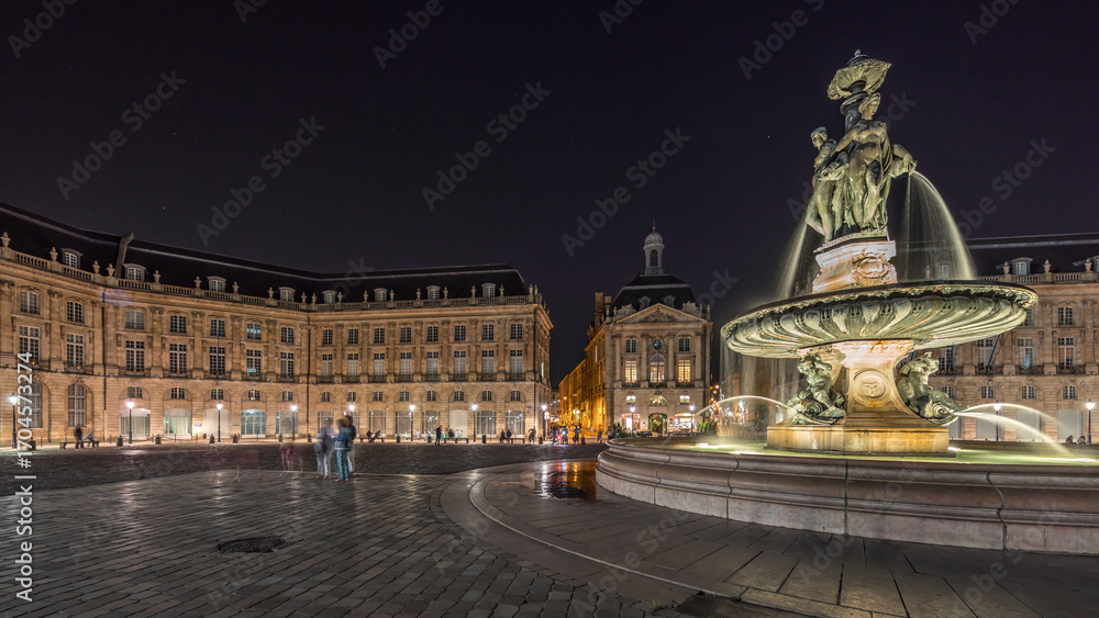 Fototapeta premium Place de la Bourse panorama and the fountains at night timelapse in Bordeaux, France.
