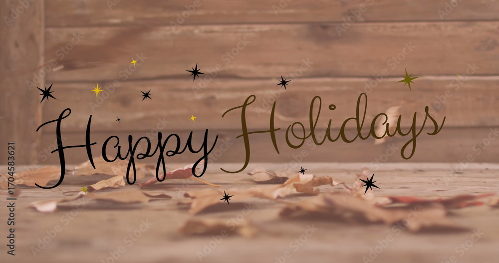 Fototapeta premium Image of happy holidays text over autumn leaves on wooden background