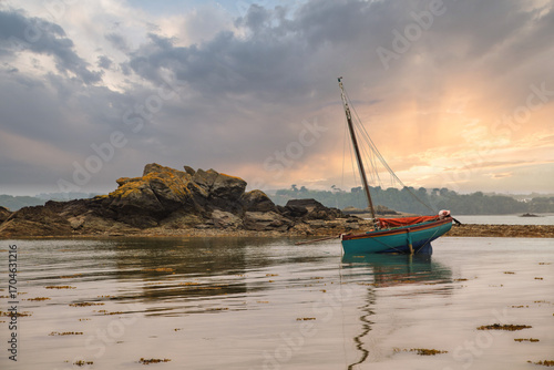 old sailboat in Brittany at rising tide.