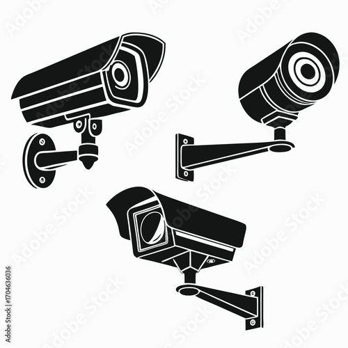 Three black silhouettes of different surveillance cameras mounted on wall brackets against a white background