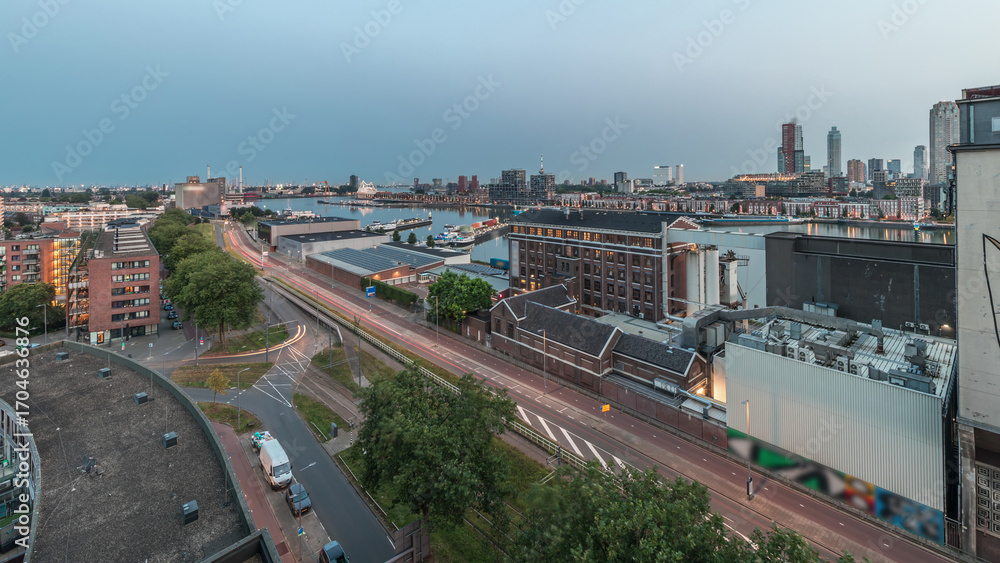 Obraz premium Aerial panoramic view over towers in Maashaven night to day timelapse in Rotterdam