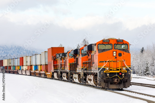 freight train pulling cargo near Whitefish, Montana on a frigid day in winter