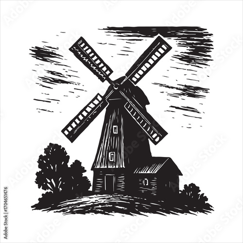A lone vintage windmill with turning sails stands against a deep blue sky on a rural Dutch landscape