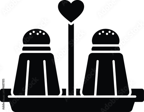 A charming salt and pepper shaker set with a heart accent, perfect for culinary themes and dining imagery.