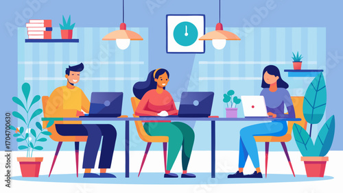 Three people working on laptops at a shared desk area