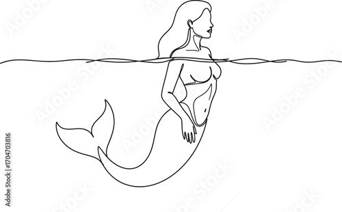Graceful mermaid emerges from clear water, exuding mystery and allure.