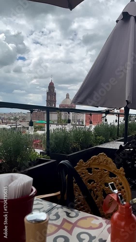 Rooftop Dining with a View of a Historic Cityscape