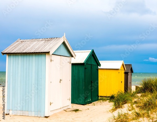 Colorful beach huts on a sandy shore