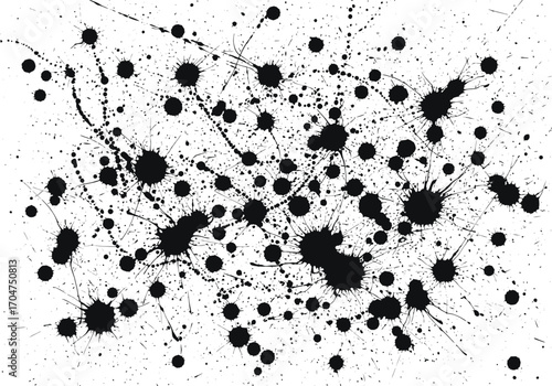 Abstract black ink splatters and drips on a white background creating a chaotic and energetic artistic pattern