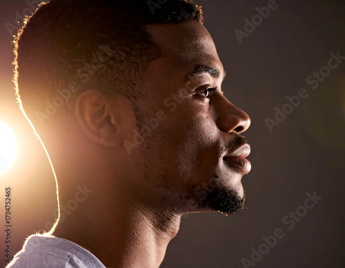 Close-up profile of a man, contemplative expression