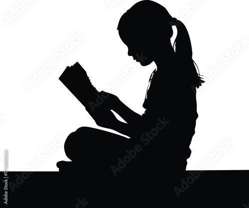 A young girl is engrossed in reading a book, her silhouette against a bright background, symbolizing childhood, education, and the joy of reading