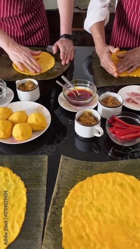 Adding Annatto oil to Corn Dough for Traditional Hallacas