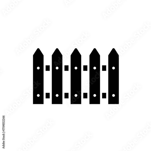 Silhouette of a Wooden Picket Fence with Pointed Tops.