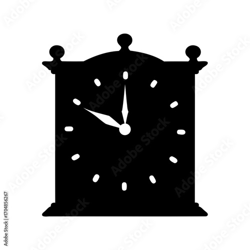 Silhouette of an antique clock showing the time near to 10 minutes past