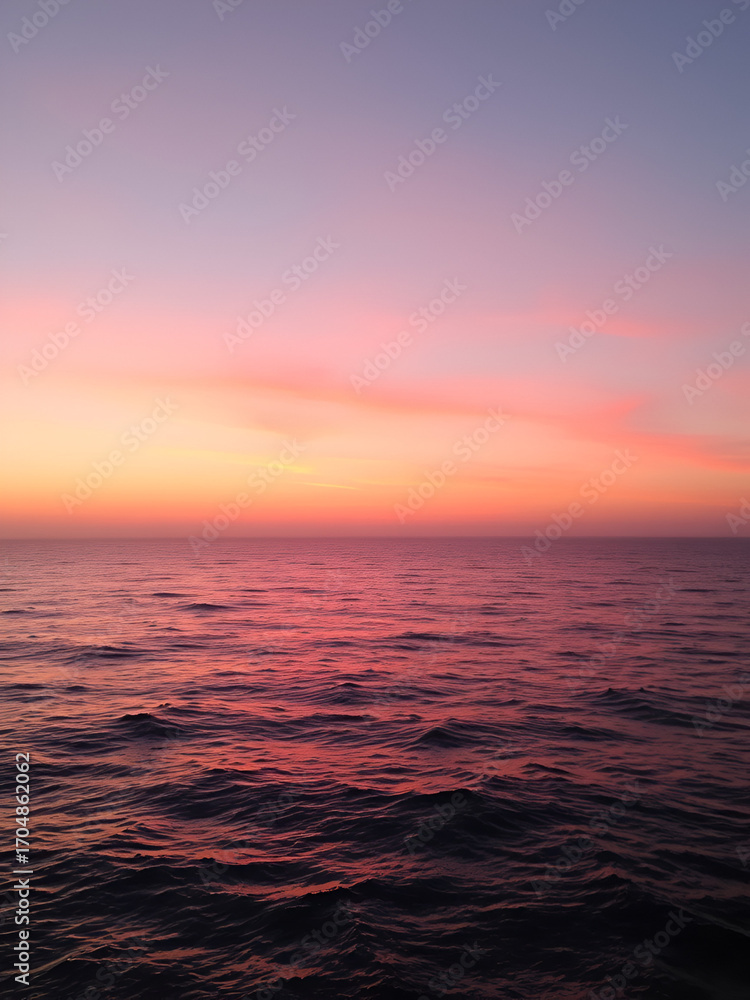 Obraz premium serene sunset casts gentle shadows tranquil ocean surface soft pink sky blending calm waves wide