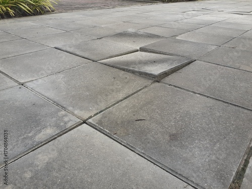 Photography Uneven sidewalks increase the risk of accidents.