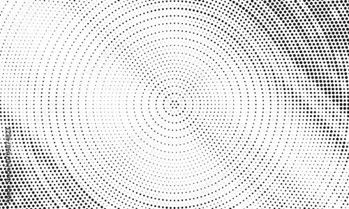 Radial halftone dots. Spotted and dotted stains gradient background. Concentric comic texture with fading effect. Black and white rough gritty wallpaper. Grunge monochrome geometric backdrop. Vector