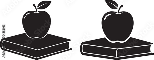 Two apples on books silhouette