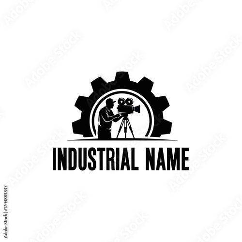 Silhouette of a filmmaker operating a vintage camera on a tripod, framed by a large gear, representing industrial filmmaking or production.