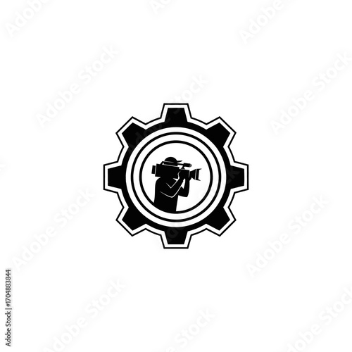 A black silhouette of a person holding a video camera, framed within a mechanical gear icon, representing media production and filmmaking.