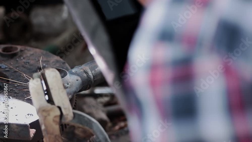 Track Shot Construction Industrial Factory or Metalwork Concept by Mechanic or Technician Welder Welding Auto Part