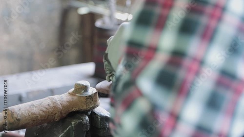 Back View Construction Industrial Factory or Metalwork Concept by Mechanic or Technician Using Grinder with Ball Joint Auto Part