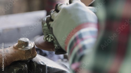 Track Shot Zoom Back View Construction Industrial Factory or Metalwork Concept by Mechanic or Technician Using Grinder with Ball Joint Auto Part