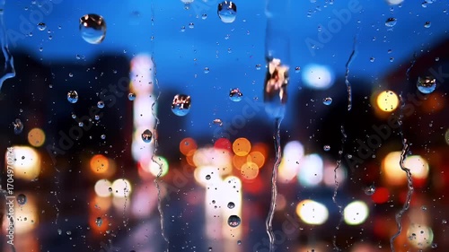 Rainy Night Cityscape Viewed Through Window.