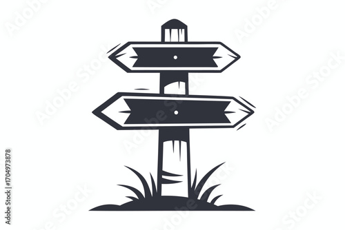 Dark minimalist directional wood sign pointing in opposite directions surrounded by grass is isolated