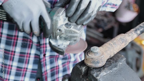Front View Construction Industrial Factory or Metalwork Concept by Mechanic or Technician Using Grinder with Auto Part Workshop