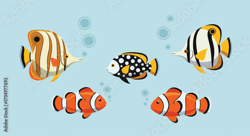 A vibrant school of tropical reef fish swims in the ocean.