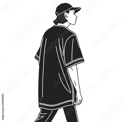 Stylish person wearing a baseball cap and oversized shirt
