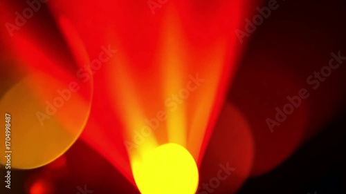 Abstract Red and Yellow Light Show: A vibrant abstract composition featuring streaks of red light radiating from a central yellow glow, with soft bokeh circles adding depth and a magical feel.