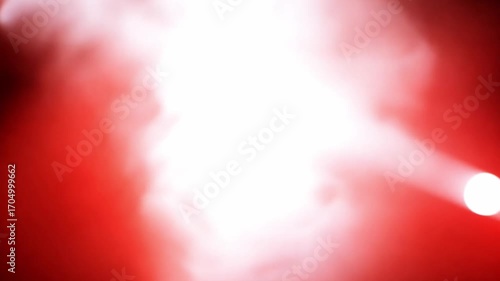 Stage Lights: Intense red stage lights illuminate a smoky atmosphere, creating a dramatic and vibrant visual effect.