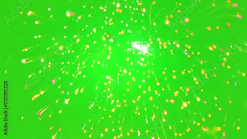 Green Screen Sparkle: A vibrant explosion of golden sparkles and light trails erupts against a vivid green backdrop, creating a dynamic and festive visual effect.