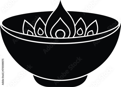 The image displays a Diya, a type of oil lamp, which is commonly associated with the Hindu festival of Diwali. 