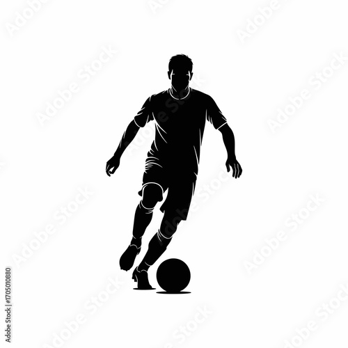 The silhouette of a soccer player dribbling the ball