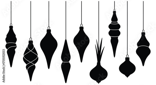 black ornaments hanging from strings in various shapes