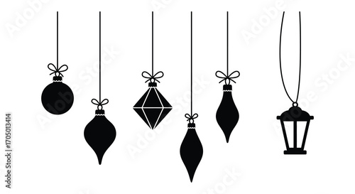 holiday ornaments hanging from strings in various shapes