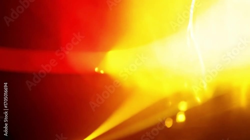 Dynamic Light Show: Abstract background with vibrant red and yellow beams of light, creating a dramatic and energetic visual effect, perfect for concerts, parties, or modern design themes.
